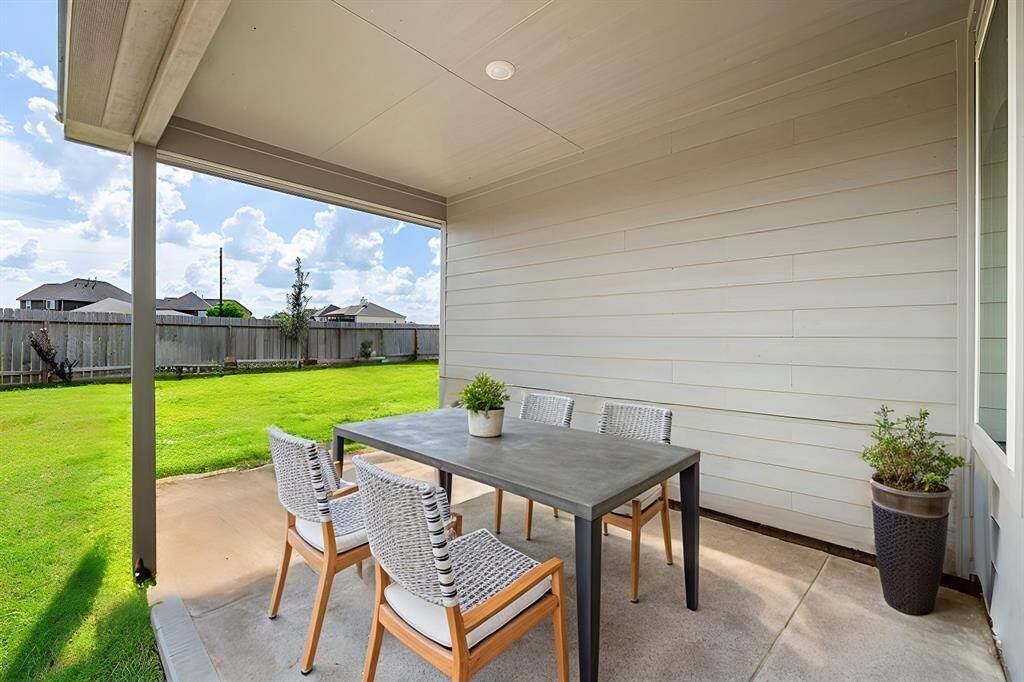 Relax on the spacious covered patio overlooking your expansive lot with no back neighbors. Enjoy the privacy and open space!