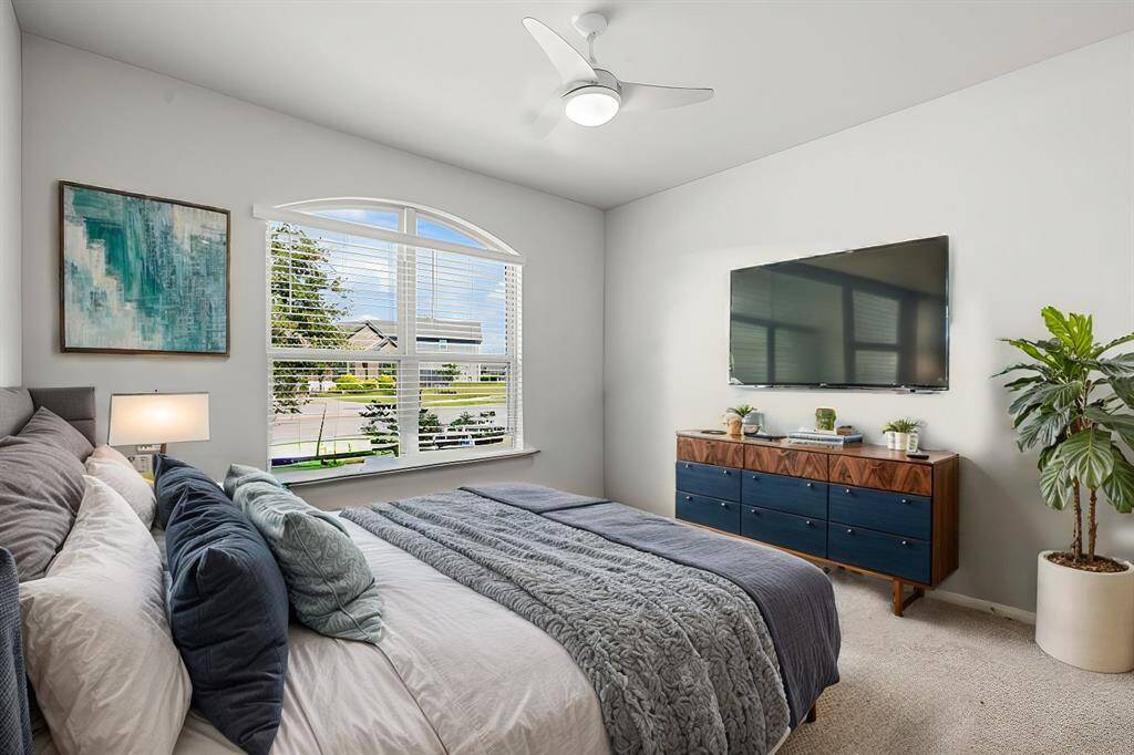 The front guest room features a large window for bountiful natural light and a generous-sized closet.