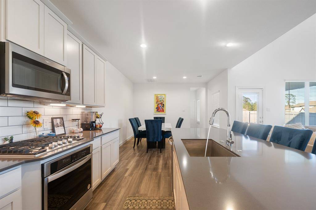 A view of the kitchen and breakfast rooms.