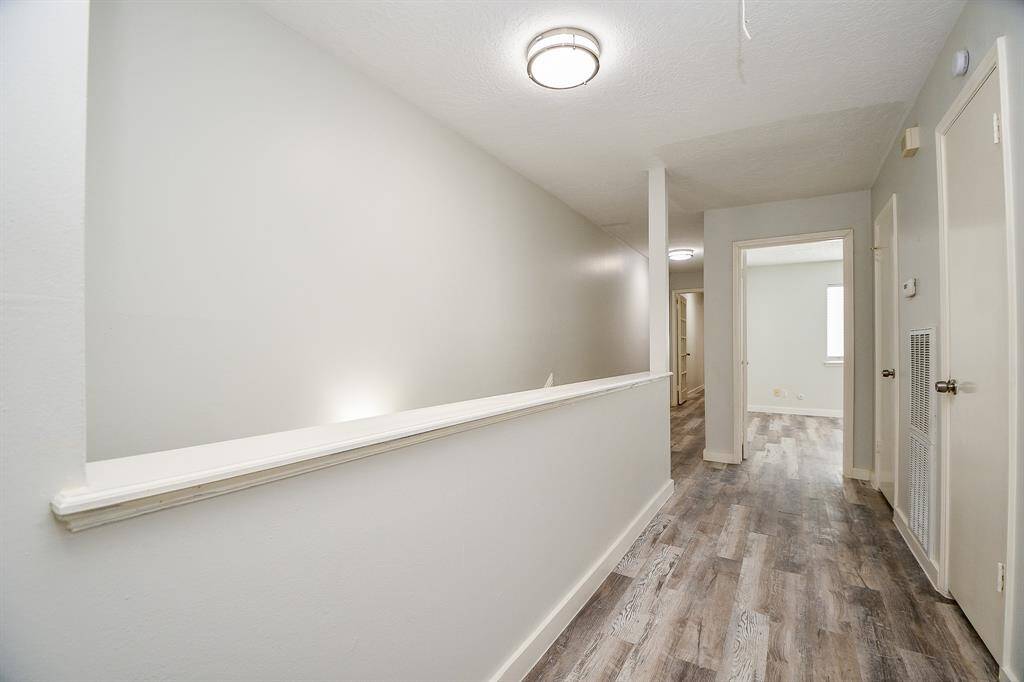 Second Floor Hallway leading to Secondary Bedroom and Game Room