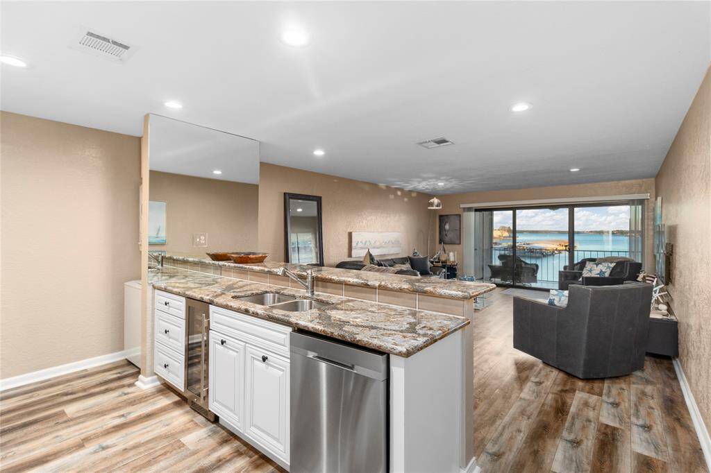 OPEN WATER VIEW OF LAKE CONROE FROM YOUR PRIVATE BALCONY! GORGEOUS KITCHEN WITH TOP-OF-THE-LINE GRANITE! ALL APPLIANCES RECENTLY UPDATED! WASHER/DRYER, REFRIGERATOR & WINE FRIG STAY! ALL FURNISHINGS INCLUDED!