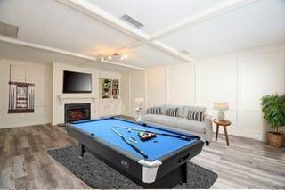Game Room with 1/2 Bath, fireplace and walk in Wet Bar.  Could be a Home Office, Media Room or Bedroom.