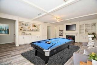 Game Room, with gas fired fireplace and built in book shelves