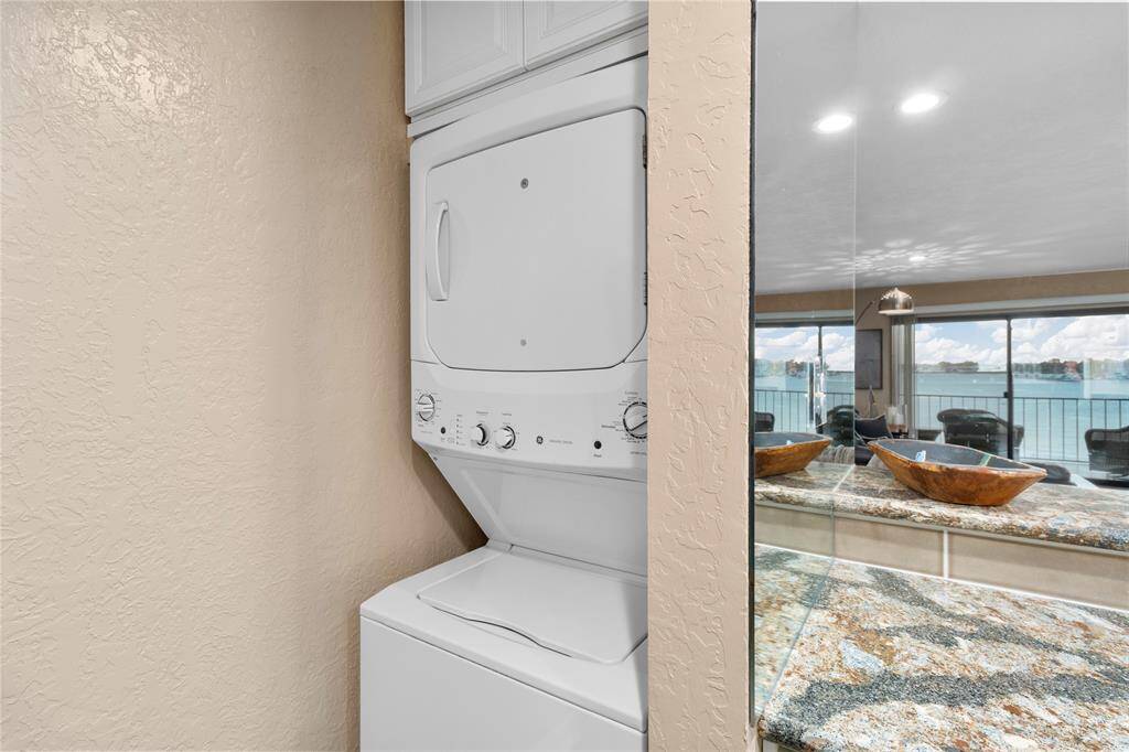 OPEN WATER VIEW OF LAKE CONROE FROM YOUR PRIVATE BALCONY! GORGEOUS KITCHEN WITH TOP-OF-THE-LINE GRANITE! ALL APPLIANCES RECENTLY UPDATED! WASHER/DRYER, REFRIGERATOR & WINE FRIG INCLUDED! ALL FURNISHINGS INCLUDED!