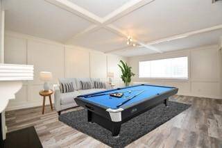 Game Room, has painted block wood paneling and looks into atrium
