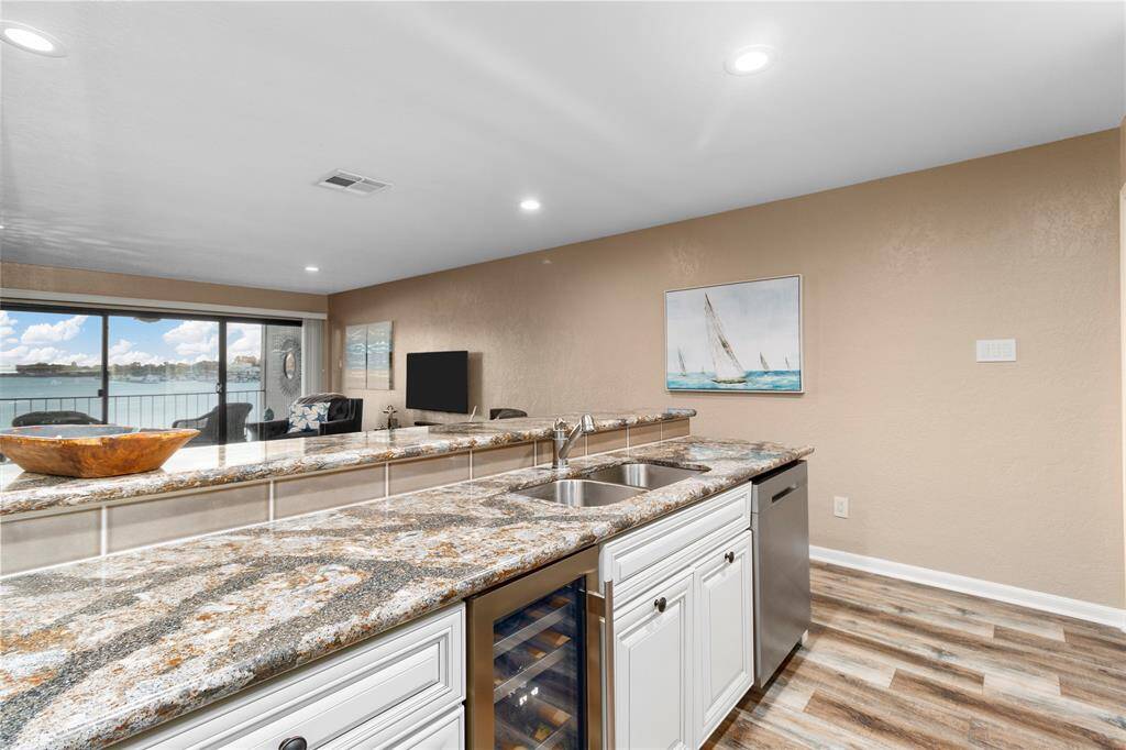 OPEN WATER VIEW OF LAKE CONROE FROM YOUR PRIVATE BALCONY! GORGEOUS KITCHEN WITH TOP-OF-THE-LINE GRANITE! ALL APPLIANCES RECENTLY UPDATED! WASHER/DRYER, REFRIGERATOR & WINE FRIG STAY! ALL FURNISHINGS INCLUDED!