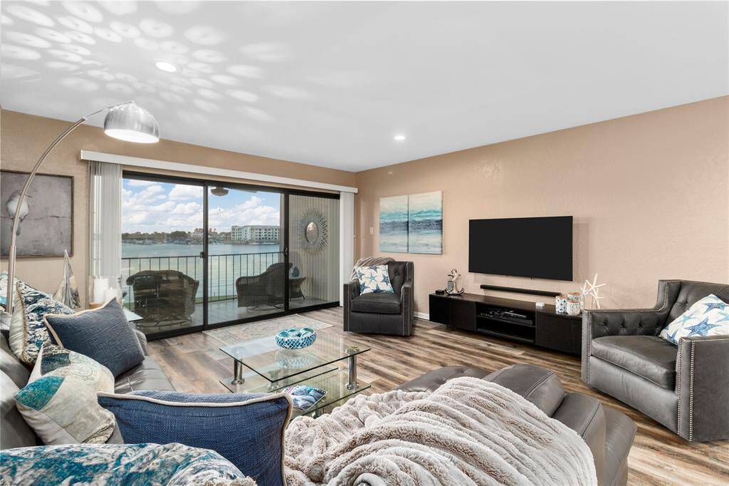 OPEN WATER VIEW OF LAKE CONROE FROM YOUR PRIVATE BALCONY! IMAGINE RELAXING DAYS & STARLIT NIGHTS IN THIS FABULOUS LIVING AREA! ALL FURNISHINGS INCLUDED!