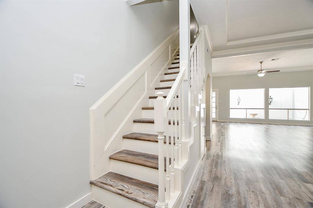 Stairway from entrance looking towards Family Room with all new waterproof vinyl plank flooring