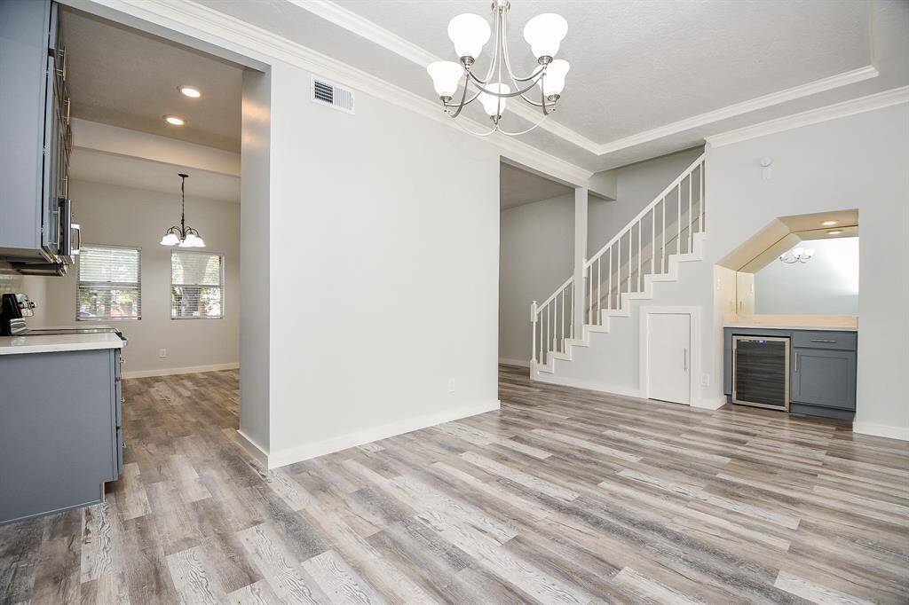 Dining Area looking into Kitchen, Dry Bar, and stairs on right