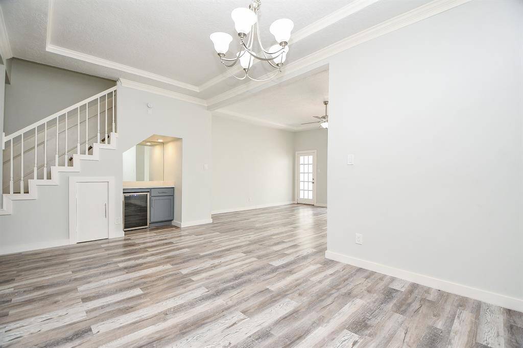 Dining Area looking toward Family Room.  Dry Bar underneath stairs