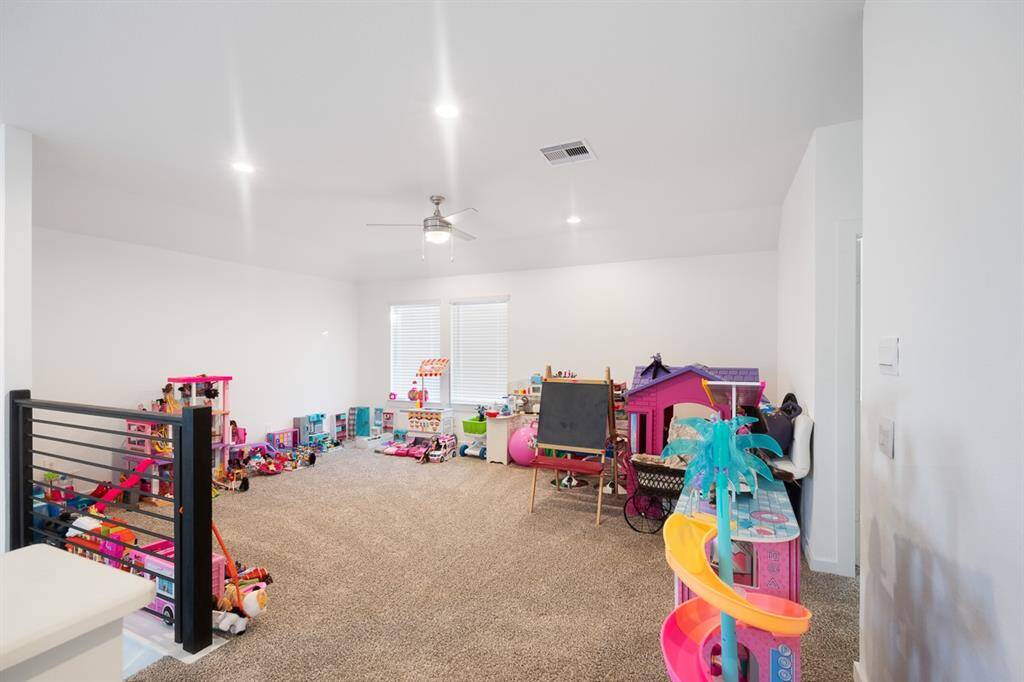 Upstairs game room - space for everyone! A great space for playing games with family and friends.
