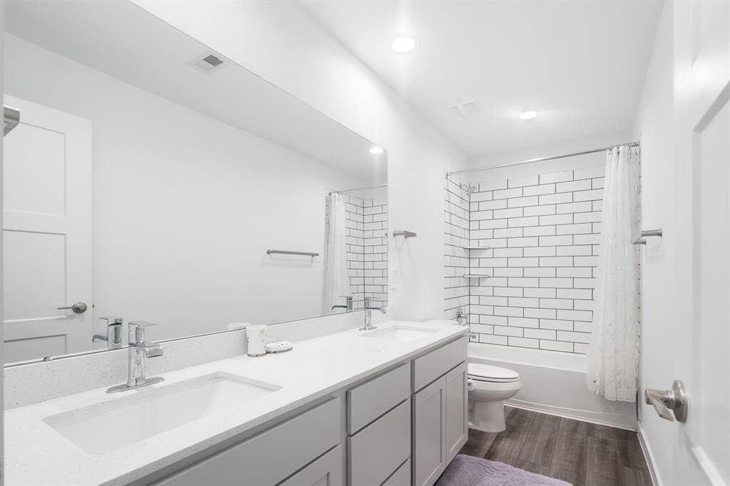 Third Bathroom with double sink.