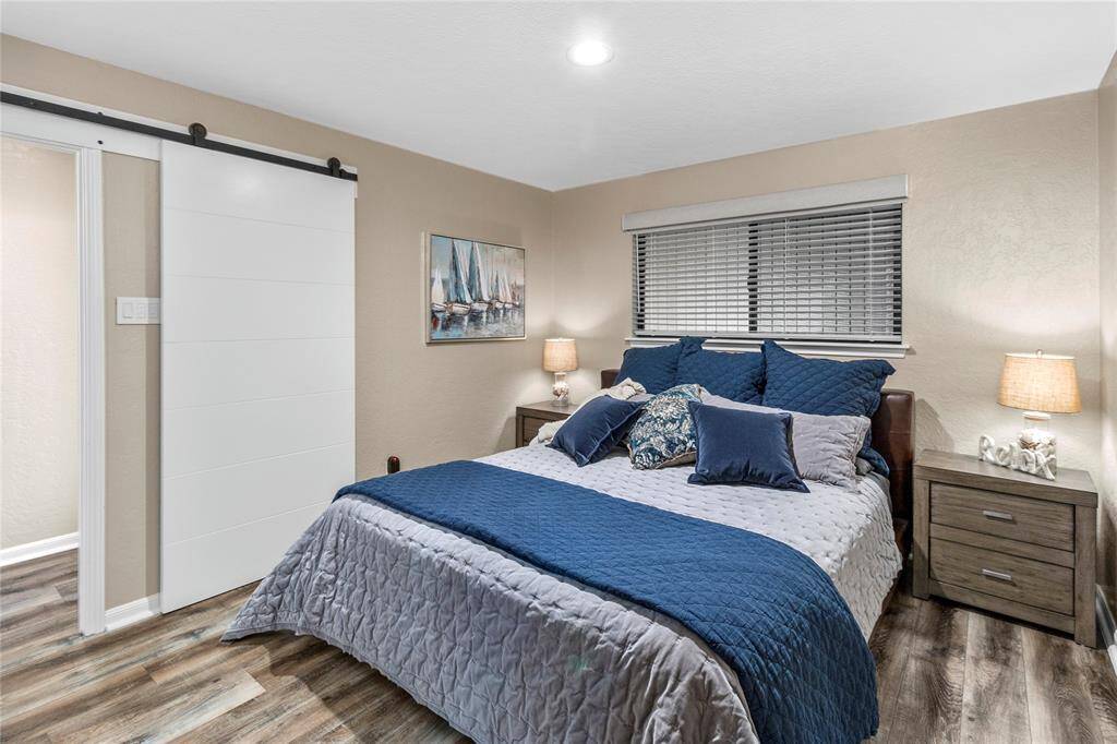 LUXURY VINYL PLANK THROUGHOUT! SPACIOUS PRIMARY BEDROOM! SLIDER DOOR TO MAIN HALLWAY! AUTOMATED PRIVACY SHADE OPERATED BY PHONE APP! ALL FURNISHINGS INCLUDED!