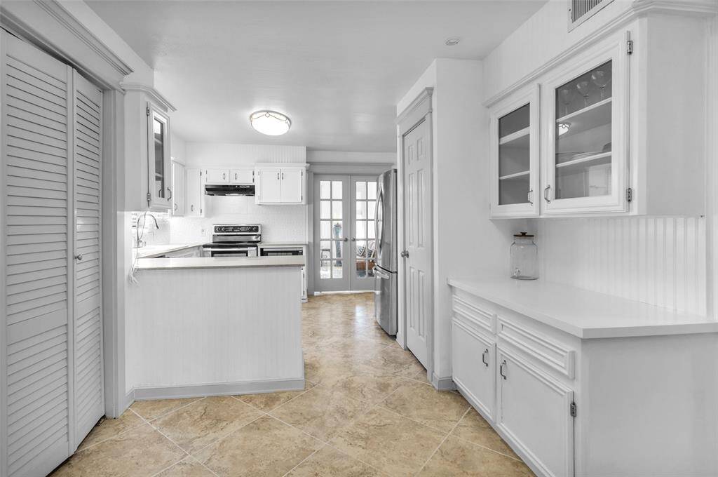 Under-cabinet lighting enhances the workspace and highlights the updated design.