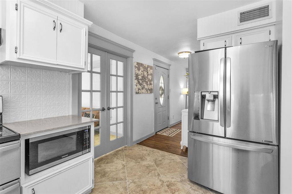 French doors lead into a private dining area off the kitchen.