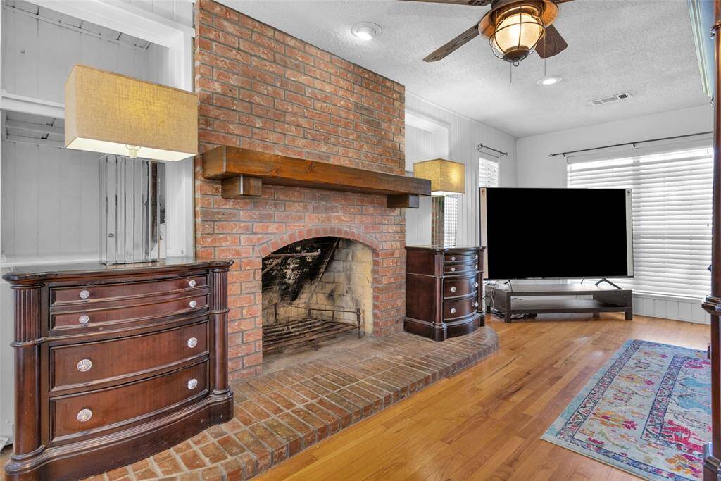 Enjoy quiet evenings by the fire in the spacious primary bedroom.