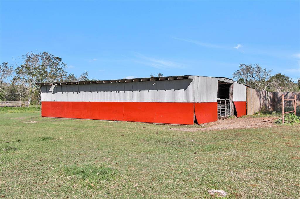 The barn is split between livestock space and storage.
