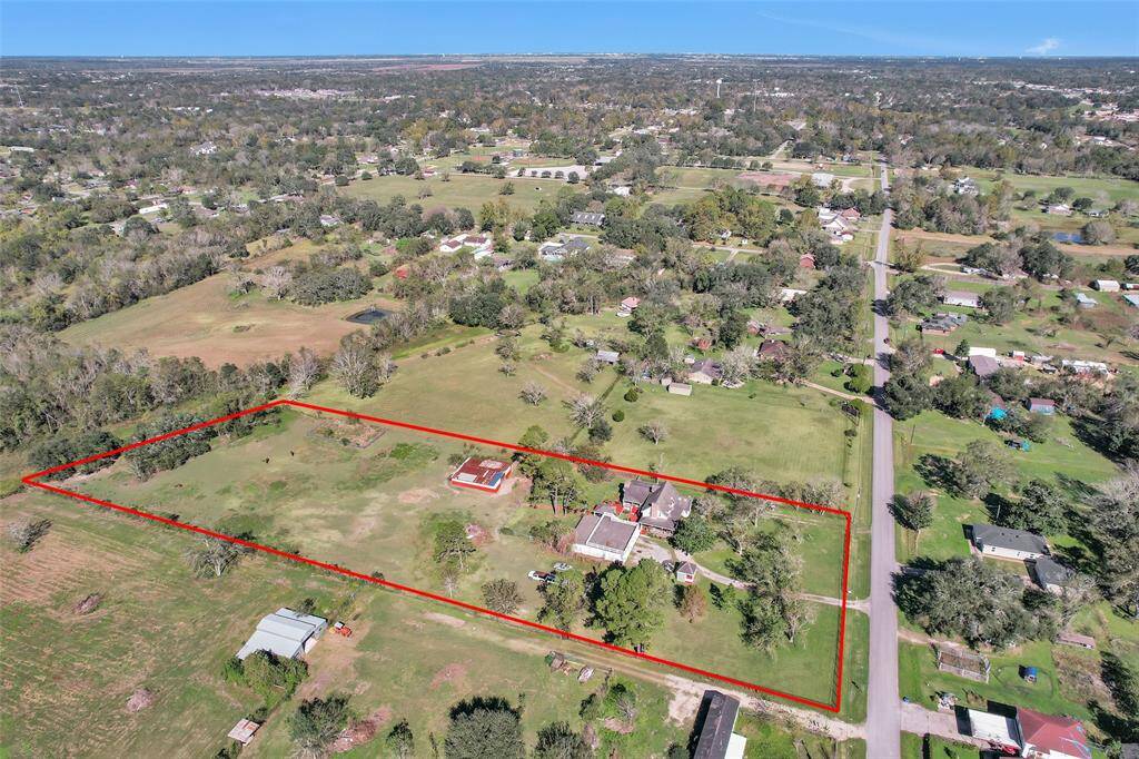 This aerial photo shows the lots lines and all the potential of this property.