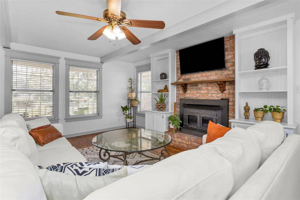 Gather around the wood-burning fireplace in the cozy living room.