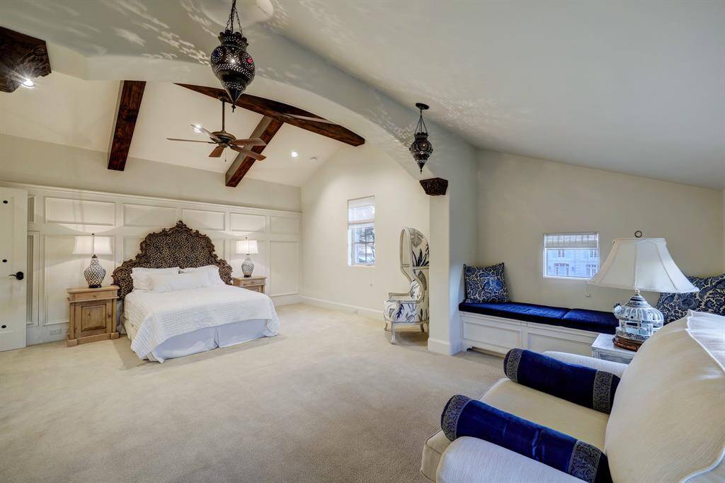 The third bedroom offers a spacious additional seating area, bathed in abundant natural light from its surrounding windows. Complete with a full ensuite bathroom, it provides both comfort and privacy in a bright and inviting setting.