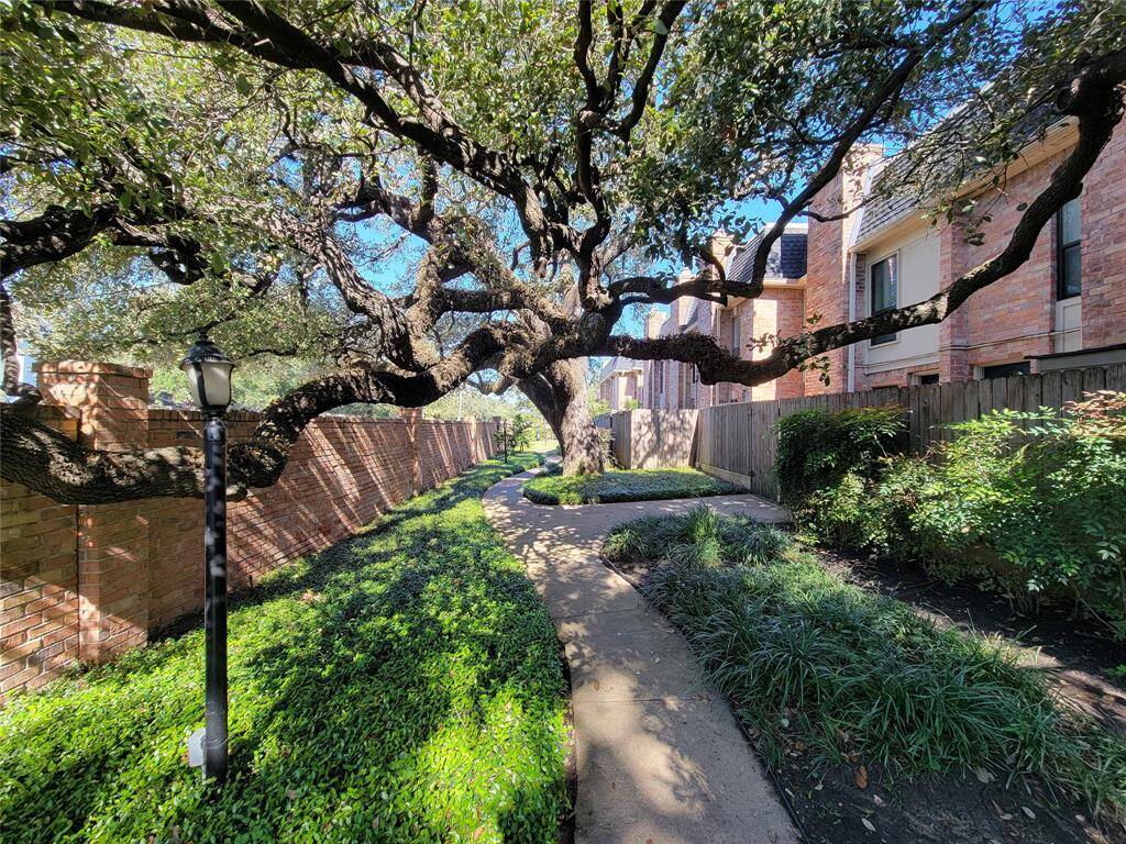 Sought-after River Oaks Gardens has mature trees and lush landscaping throughout the community.