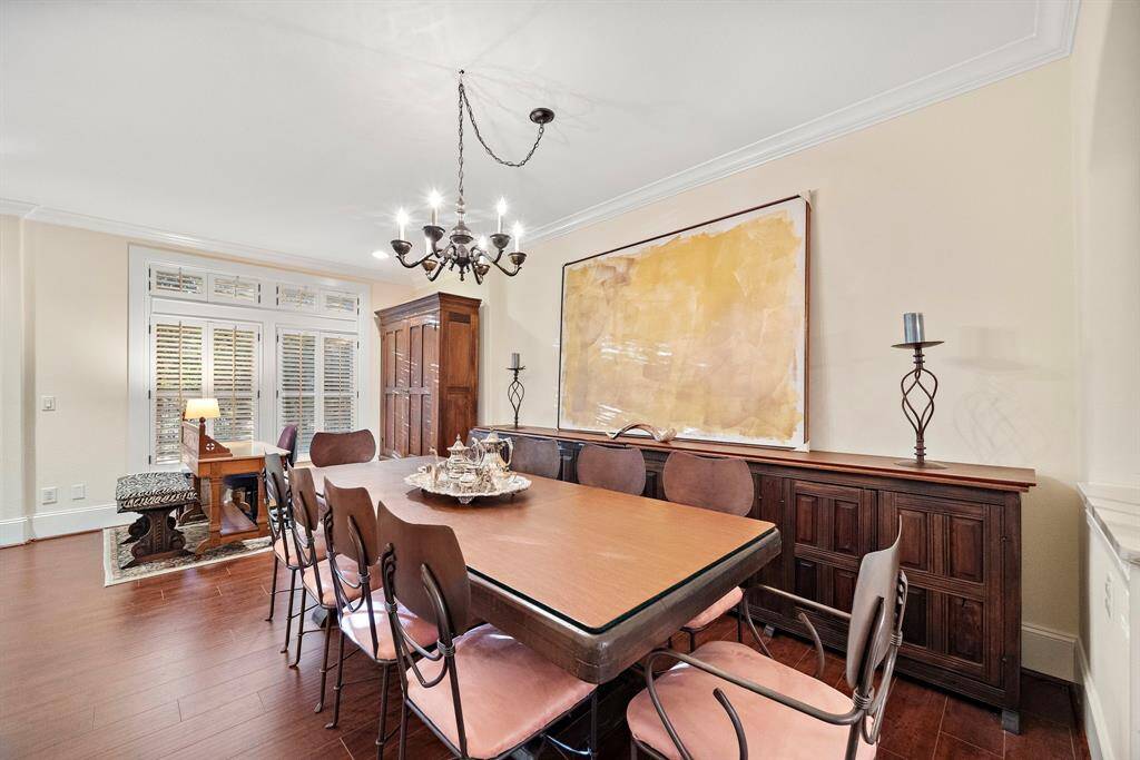 Natural light streams through expansive windows, complementing the dining room’s sophisticated finishes and creating an elegant space for any occasion.