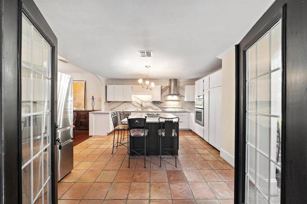 The kitchen offers an ideal space for entertaining or everyday living, enhanced by thoughtful upgrades throughout.