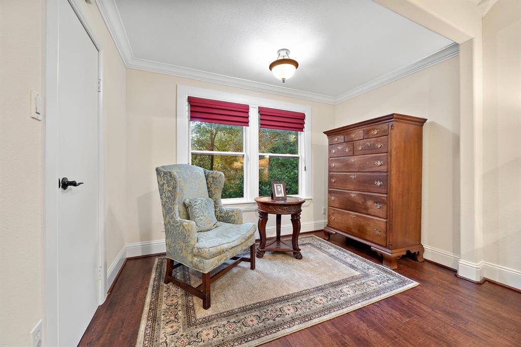 Tucked within the primary suite, the sitting area is bathed in natural light and offers a cozy space for relaxation, all while enjoying picturesque outdoor views!