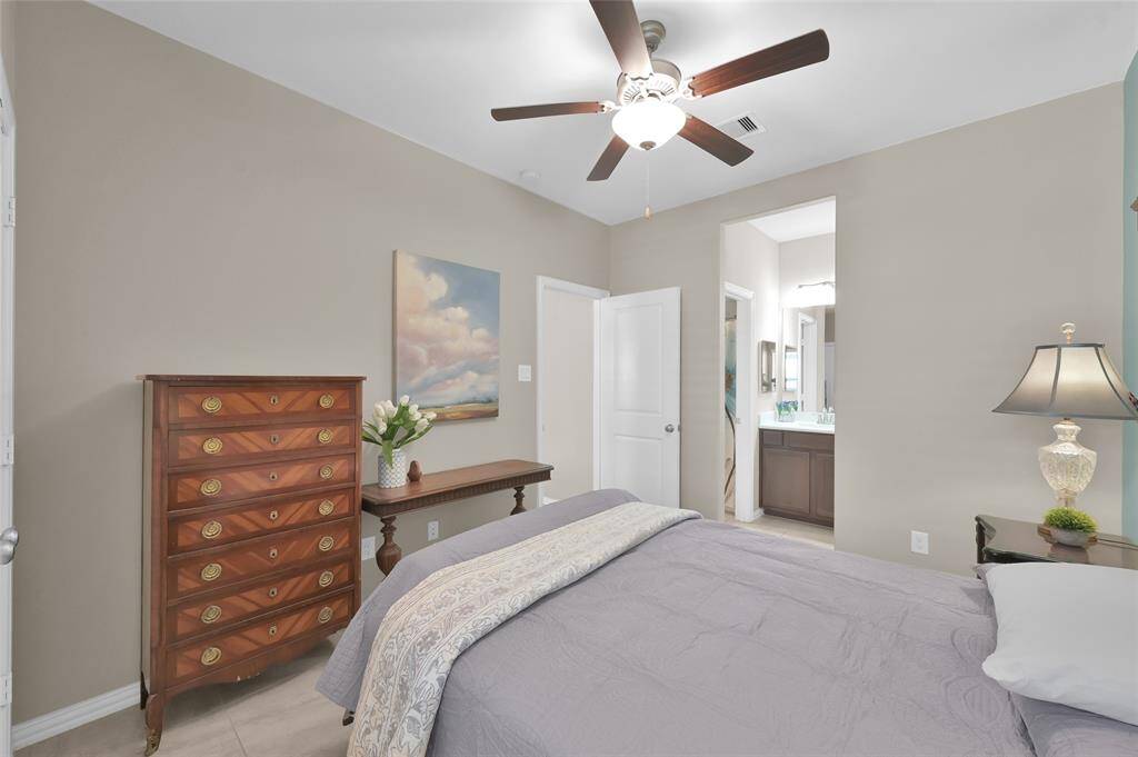 Secondary bedroom 1, looking into the sink area and door into the flex space opening
