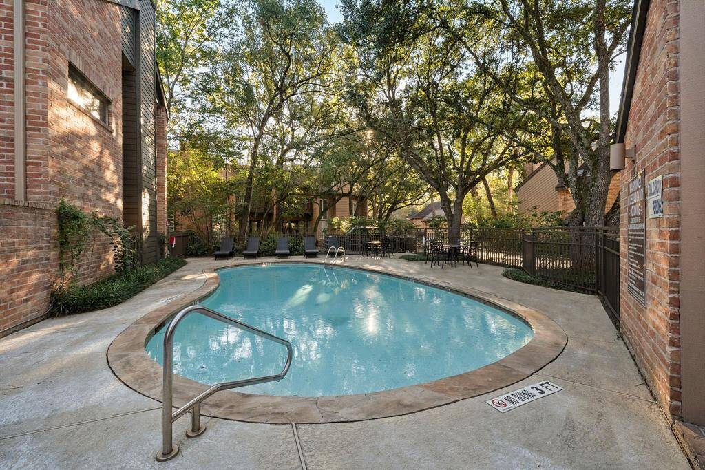 Tucked within the Woods at Hudson, the neighborhood pool provides a serene escape framed by mature trees and vibrant landscaping. Ample lounge seating and shaded spots make it a delightful spot to relax and recharge.