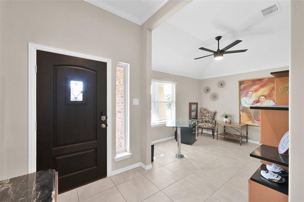 View looking back at the front door and into the office