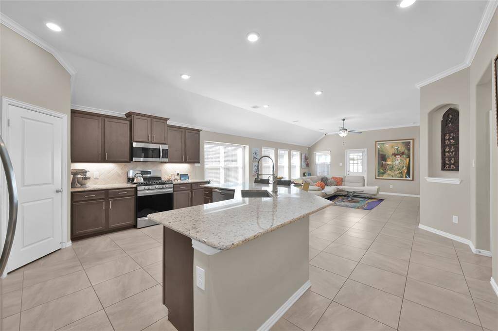 As you come down the entry hallway, the kitchen area this is your view