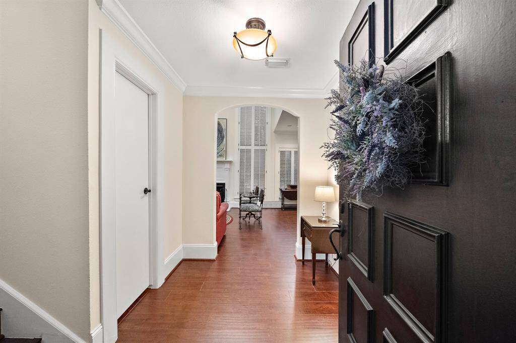 Step into the foyer, where you'll be greeted by wood floors and a bright layout extending throughout the entertainment areas.