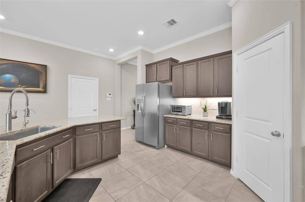Door pictured  straight ahead leads to the garage.  Door to the right is the large pantry
