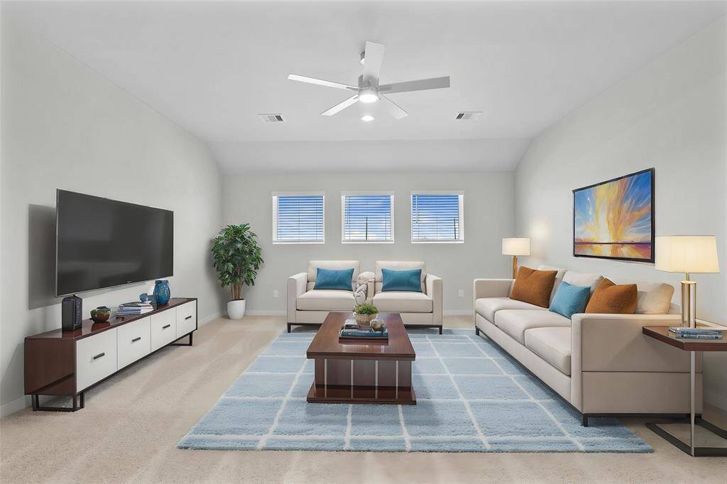 Come upstairs and enjoy a day of leisure in this fabulous game room! This is the perfect hangout spot or adult game room, this space features plush carpet, high ceiling, ceiling fan, custom paint and windows with privacy blinds.