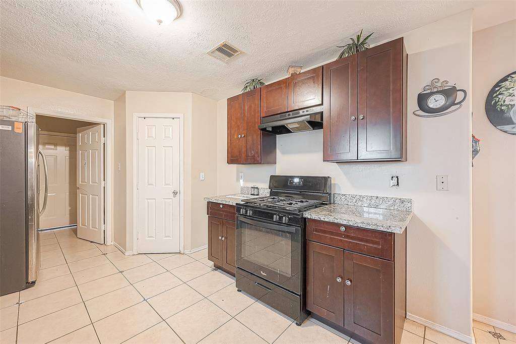 The kitchen is conveniently located off of the dining room and just short distance from living room.