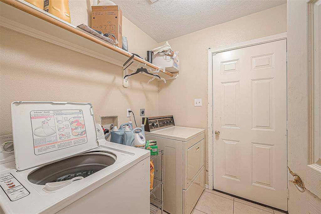 Laundry room is conveniently located off of the kitchen, leading to backyard. offering space for your washer and dryer along with additional storage for cleaning supplies.