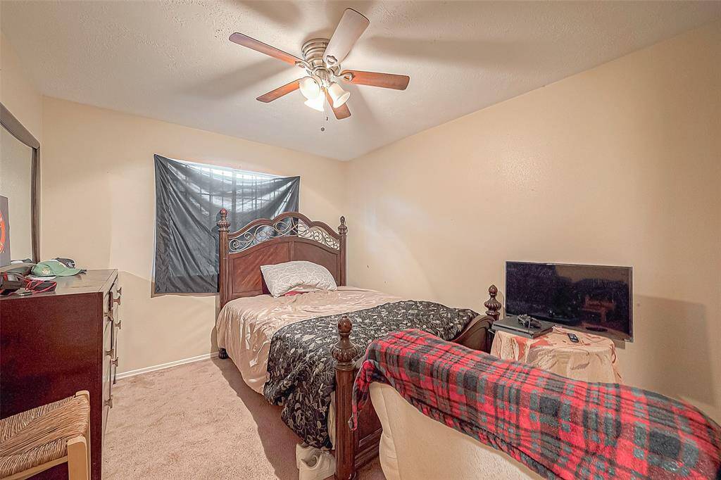 The home features three cozy bedrooms, each offering a comfortable retreat.