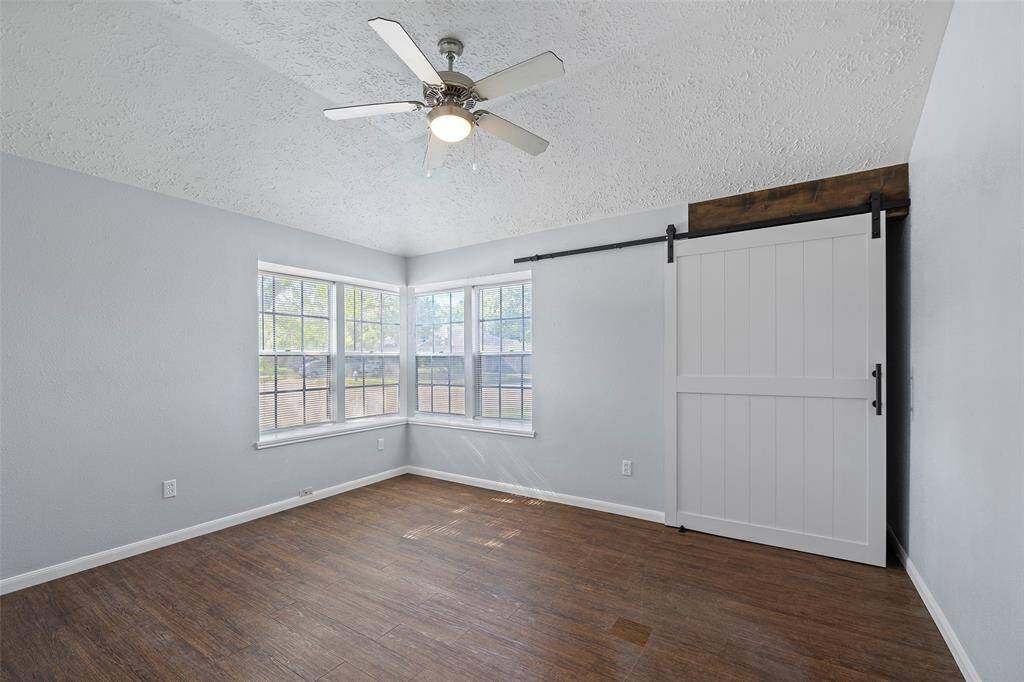 Secondary Bed with Barn door enclosed work or closet space