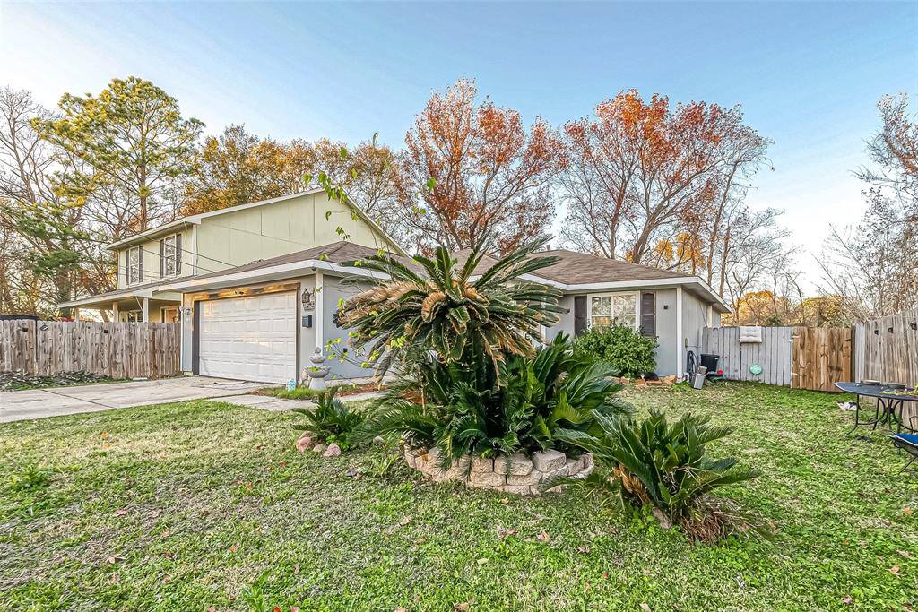 Beautiful landscape, the lush palm tree enhances the homes curb appeal.