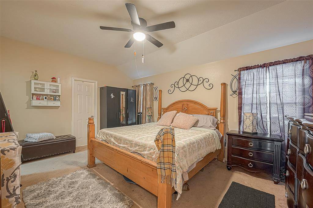 Primary bedroom is designed for relaxation and convenience.