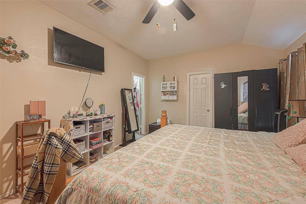 Primary bedroom features a large walk in closet for ample storage and designed to provide a relaxing atmosphere.