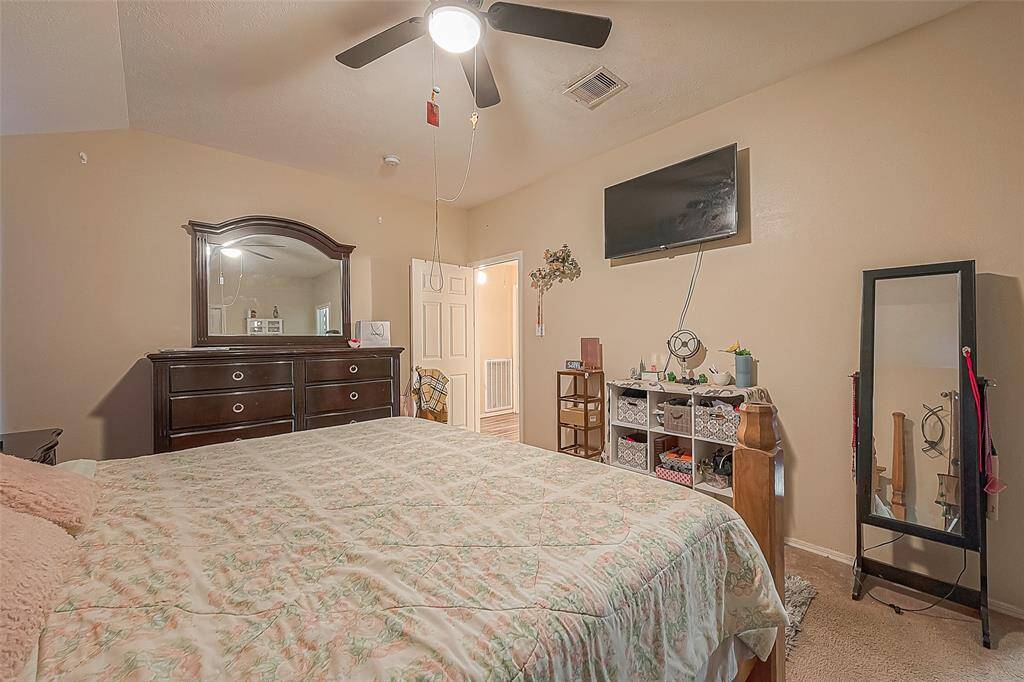 Primary bedroom is perfect for unwinding after a long day.