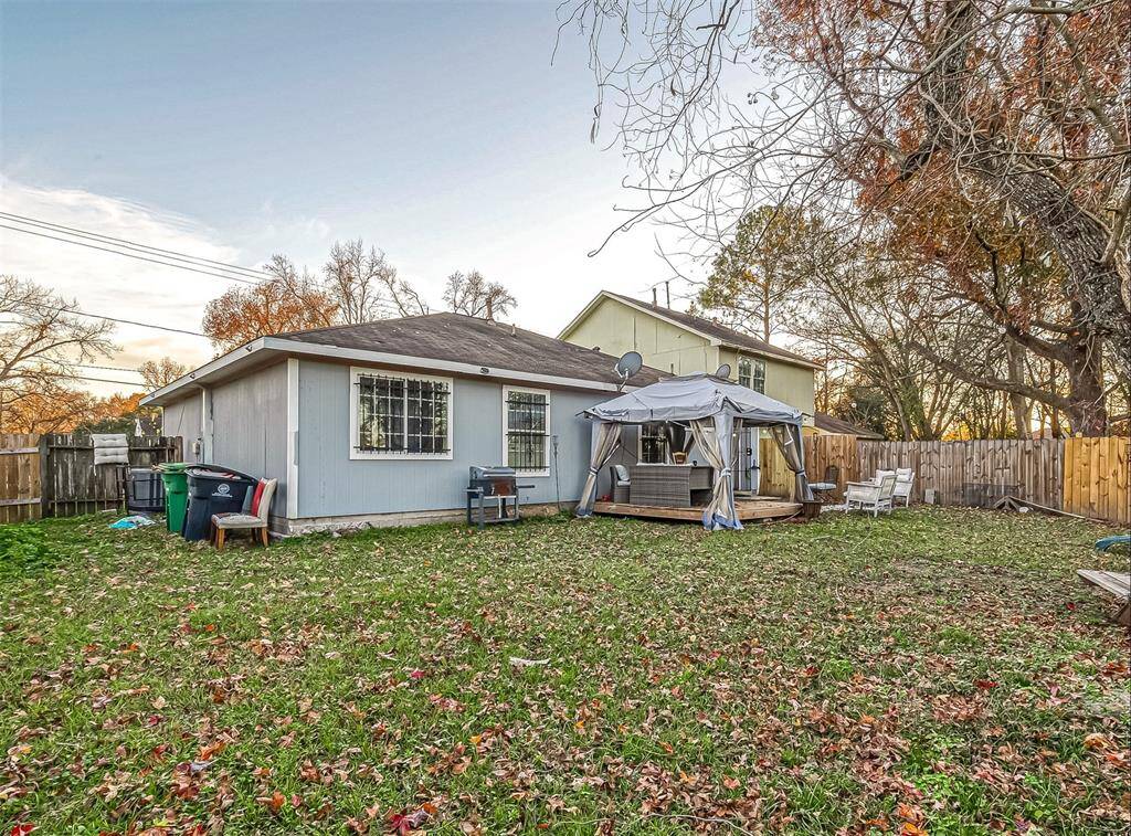 The backyard offers a private and spacious retreat for outdoor gatherings or peaceful relaxation.