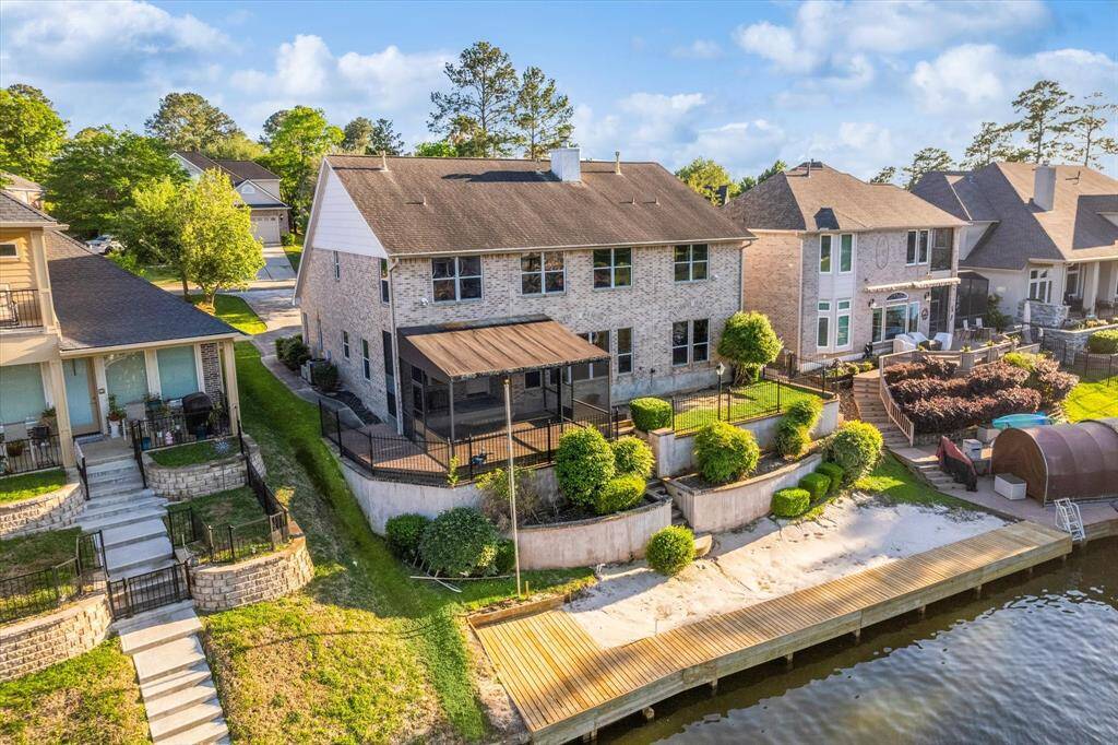 Back of home. Bulkhead/Decking was replaced in February. Sandy area has been sodded.