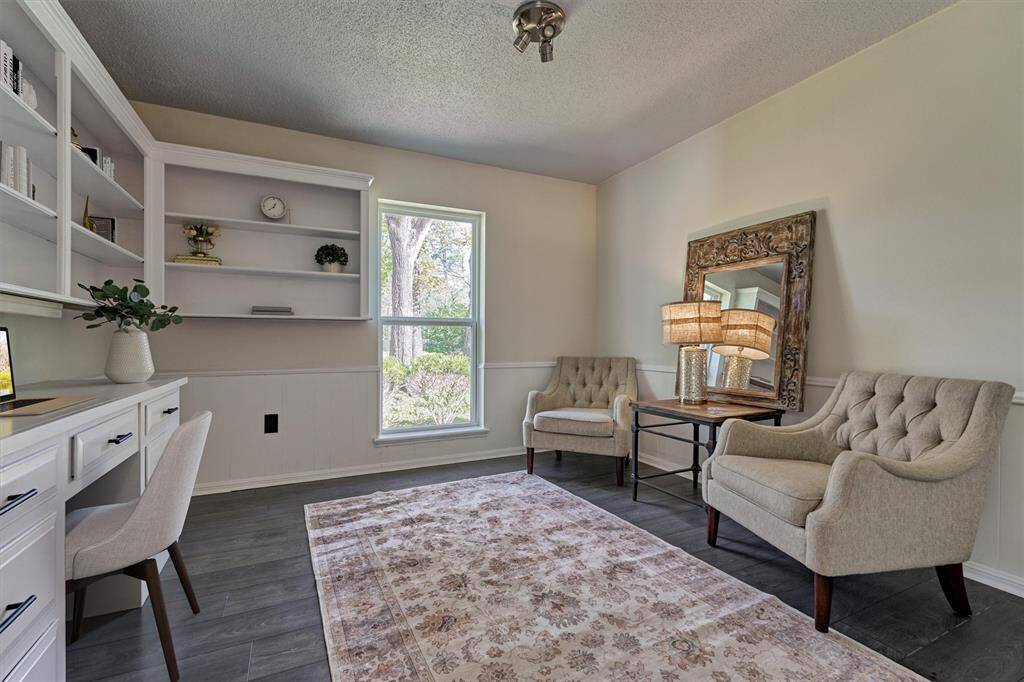 Flex Room that could be used as a kid's playroom, executive study, homeschool or homework room