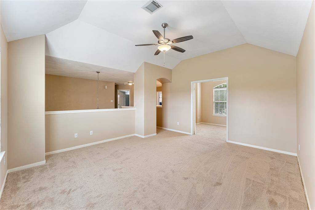 Looking back towards the primary bedroom from your private bathroom, overlooking your fully fenced private backyard with NO neighbors!