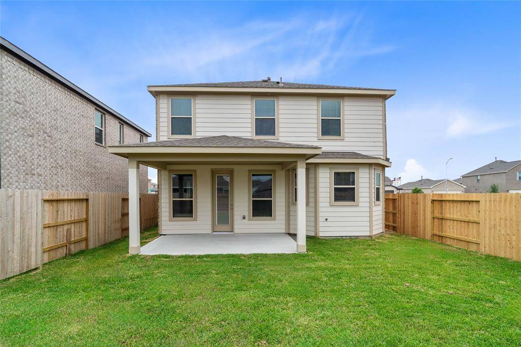 Come and see this spacious backyard with its beautiful covered patio. There is plenty of room for the kids to play and adults to relax!