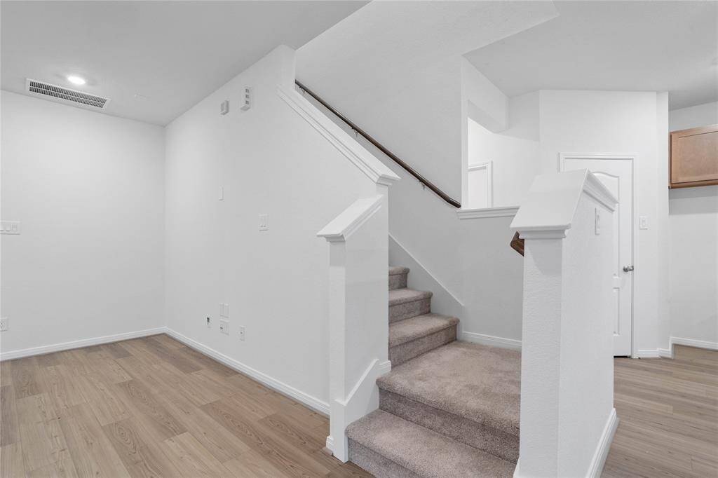 The beautiful staircase leads to the second floor loft and bedrooms.