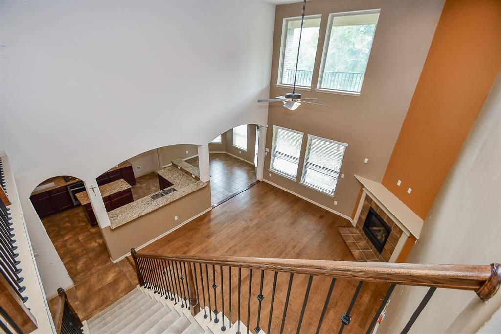 View of open kitchen & family room from second floor.